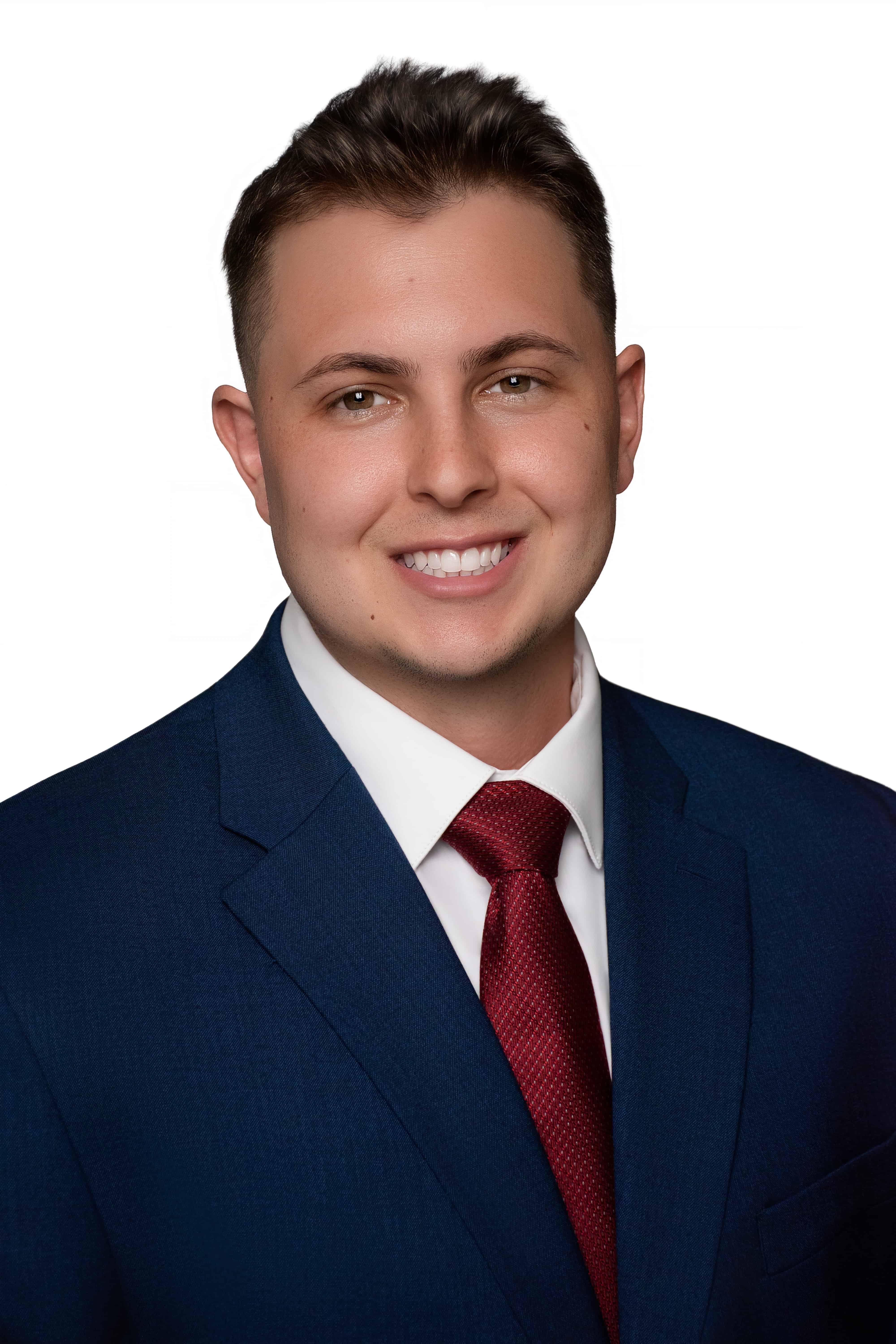 Smiling professional headshot in a navy suit by DP Photography LLC, Mississippi
